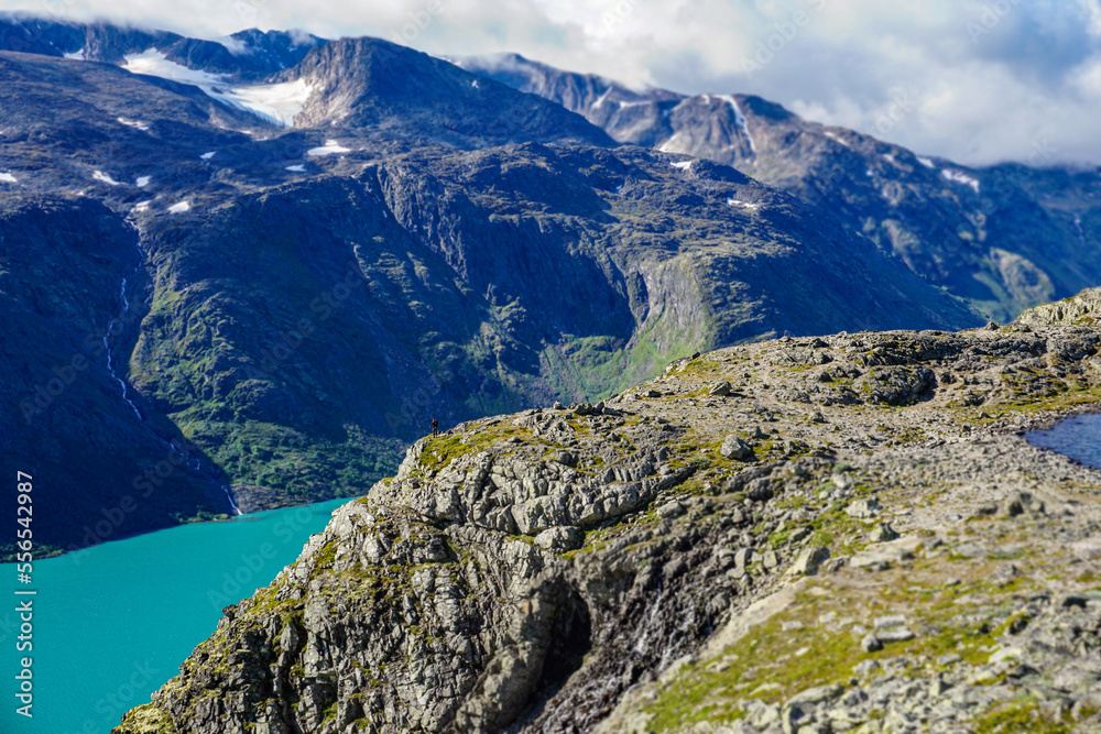 A man near a precipice of a fjord horizontal photo