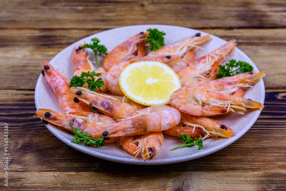 Shrimps with lemon and parsley on a plate Shrimps with lemon and parsley on a plate