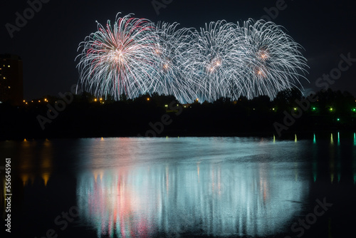 Beautiful fireworks with reflection in the pond photo