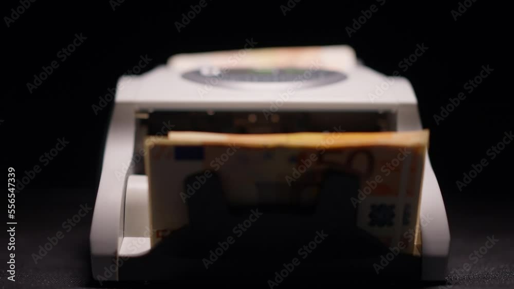 Front view banknote counter with male hand pressing start and Euro