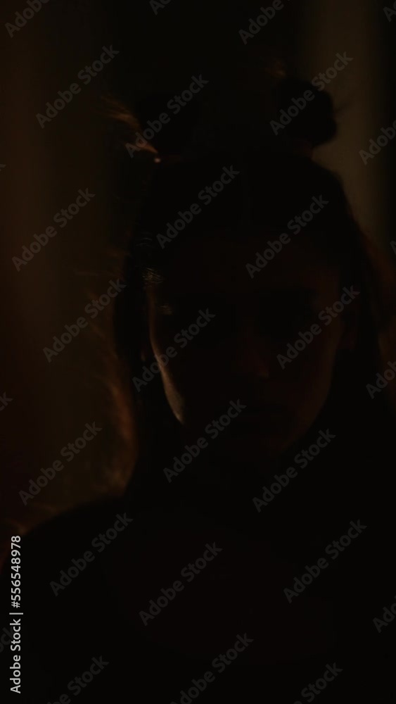 Serious cyber woman in LED glasses in light of neon Serious cyber woman in LED glasses in light of neon