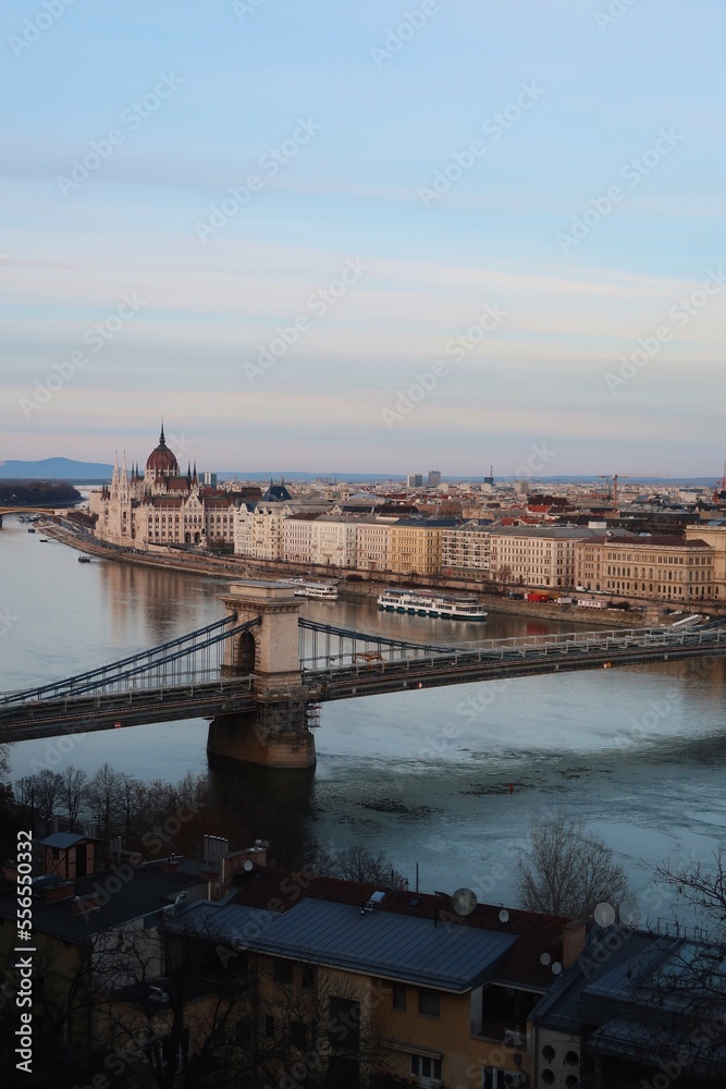 View of the Danube, the Hungarian Parliament Building and the Chain Bridge in Budapest, vertical photo