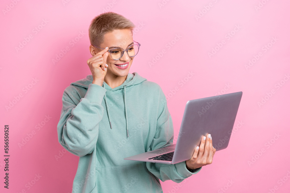 Photo portrait of attractive young woman fix touch eyewear video conference dressed stylish khaki outfit isolated on pink color background Photo portrait of attractive young woman fix touch eyewear video conference dressed stylish khaki outfit isolated on pink color background