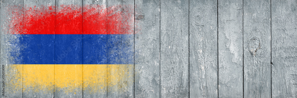 Flag of Armenia. Flag is painted on a gray wooden plank surface. Wooden background. Plywood surface. Copy space. Textured background
