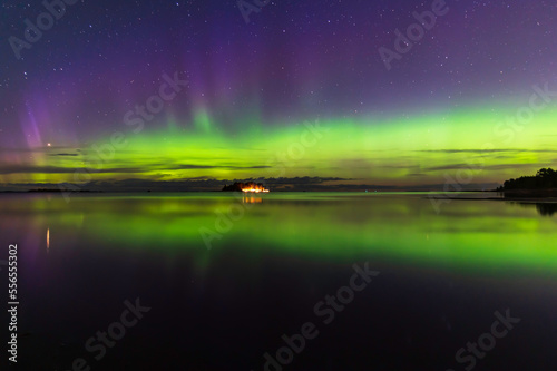 Northern lights  reflections in the water. Storsand Jakobstad Pietarsaari. Finland