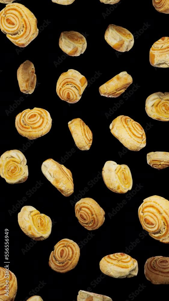 Vertically composed looping animation featuring a cloud of Cinnamon Scrolls floating in place on an alpha transparent background. Vertically composed looping animation featuring a cloud of Cinnamon Scrolls floating in place on an alpha transparent background.
