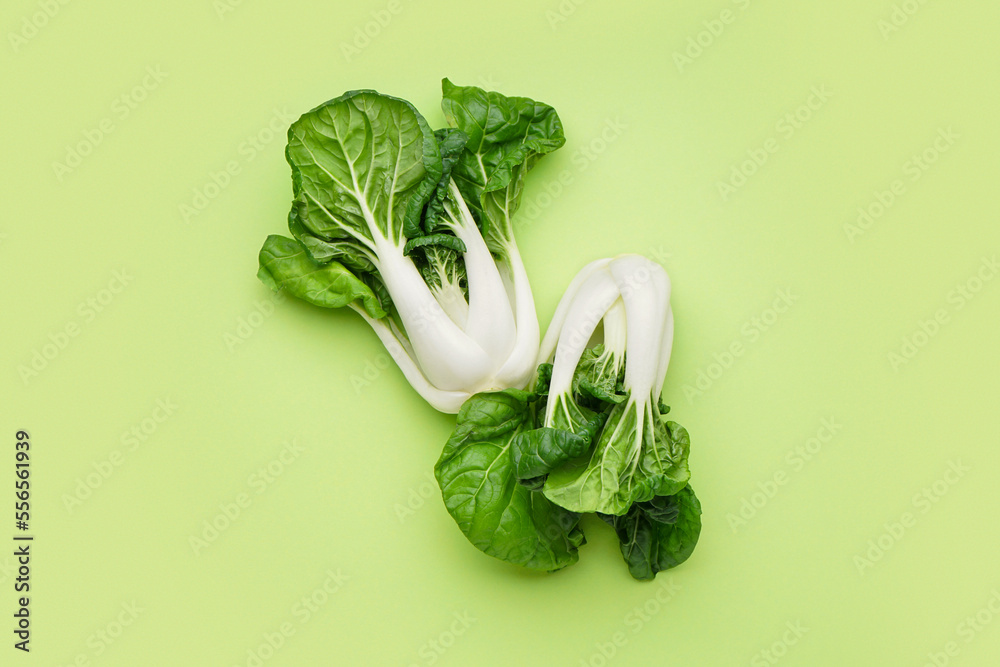Fresh pak choi cabbage on green background - obrazy, fototapety, plakaty 