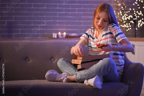 Young woman with tasty pizz...
