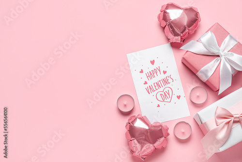 Card with text HAPPY VALENTINE'S DAY, balloons, candles and gifts on pink background