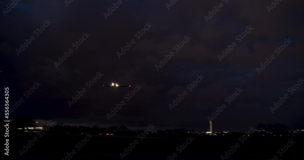 Camera Panning To Follow Plane On Approach To Landing At Night Camera Panning To Follow Plane On Approach To Landing At Night