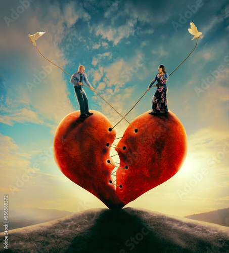 Fototapet Man and woman pull heart together