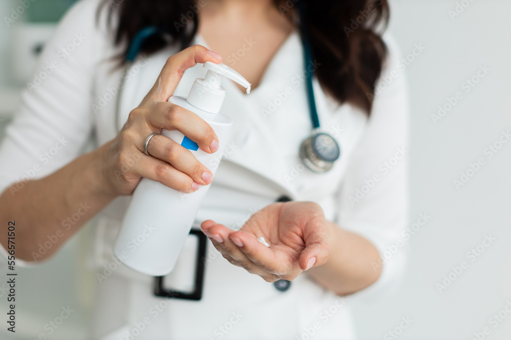 the dermatologist touches the hands smears with cream, dry skin, skin disease. close up the dermatologist touches the hands smears with cream, dry skin, skin disease. close up
