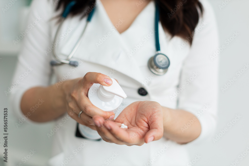 the dermatologist touches the hands smears with cream, dry skin, skin disease. close up the dermatologist touches the hands smears with cream, dry skin, skin disease. close up
