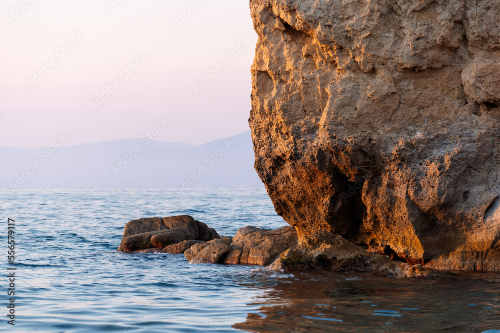 Rock at the seashore. Rocky shore on the mediterranean sea. Sardinia, Italy, closeup