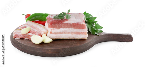 Pieces of pork fatback and different spices on white background
