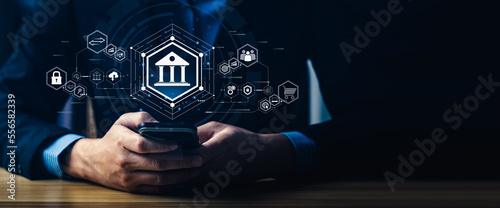 Fotografie Businessman using mobile online banking and payments, digital marketing