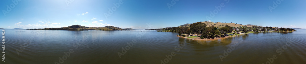 360 degree photography of Overlooking Lake Hume is the picturesque town of Bellbridge, offering views of nearby Bethanga Bridge in Albury NSW, Australia, the calm water shot by drone. 360 degree photography of Overlooking Lake Hume is the picturesque town of Bellbridge, offering views of nearby Bethanga Bridge in Albury NSW, Australia, the calm water shot by drone.