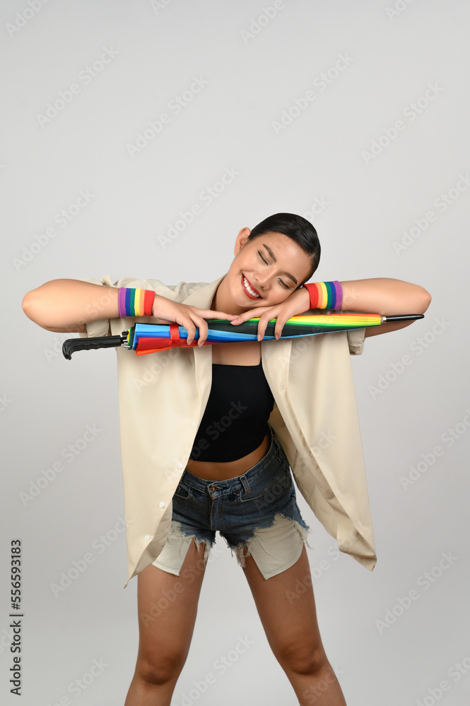 Pretty woman LGBQ pose with colorful umbrella