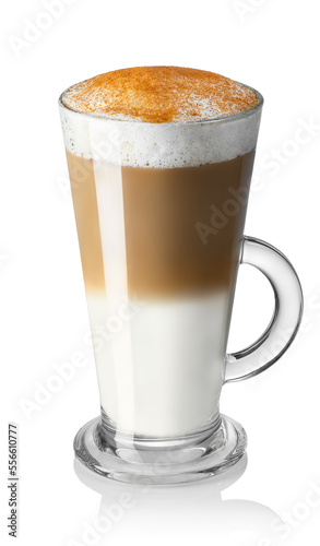 latte macchiato with milk foam and cinnamon powder in glass cup isolated on white