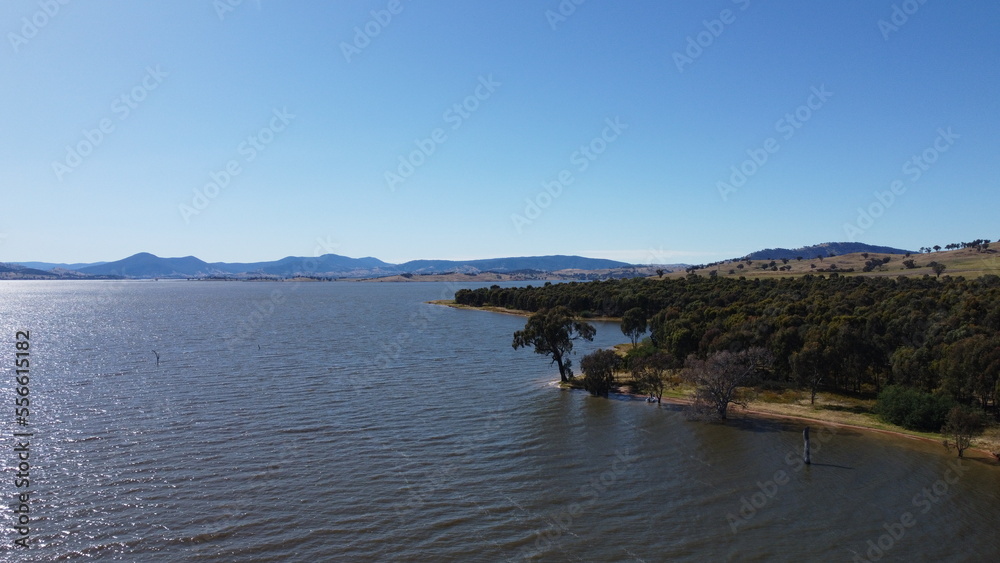 The aerial drone point of view photo at Bowna Waters Reserve is natural parkland on the foreshore of Lake Hume popular boat launching location in Albury, NSW ,Australia. The aerial drone point of view photo at Bowna Waters Reserve is natural parkland on the foreshore of Lake Hume popular boat launching location in Albury, NSW ,Australia.