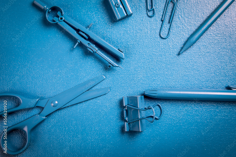 Stationery, school and office supplies on a blue background Stationery, school and office supplies on a blue background