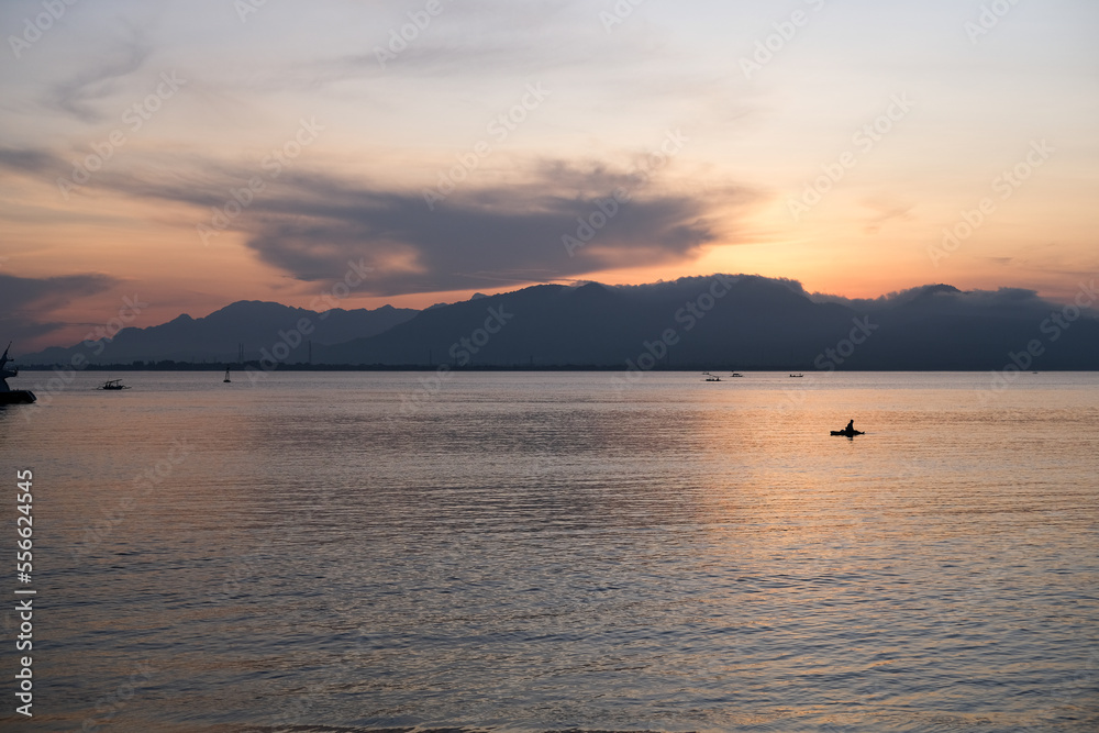sunrise view in Banyuwangi, sunrise over the mountain, sunrise on the sea, sunrise on the beach, sunrise over Bali Island sunrise view in Banyuwangi, sunrise over the mountain, sunrise on the sea, sunrise on the beach, sunrise over Bali Island