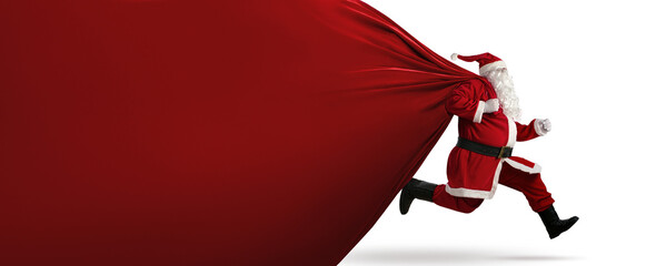 Santa Claus on the run to delivery christmas gifts with copy space