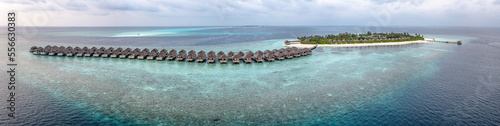 Resort with water bungalows on turquoise Indian ocean, Maldives photo