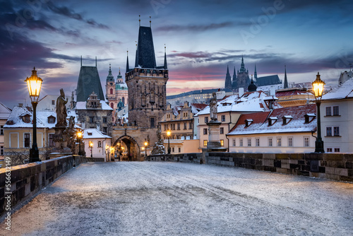 Photography View from the historic Charles Bridge in Prague, Czech Republic, to the snow cov