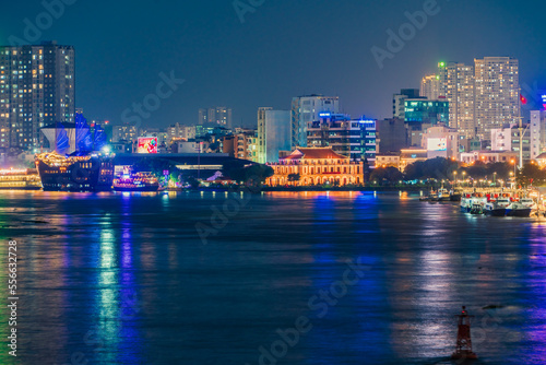 Ho Chi Minh City, Vietnam - December 26, 2022: Beautiful night in Ho Chi Minh city known as Saigon, one of the big cities is developed in Vietnam. See Bitexco tower, saigon river and center city view  #556632728