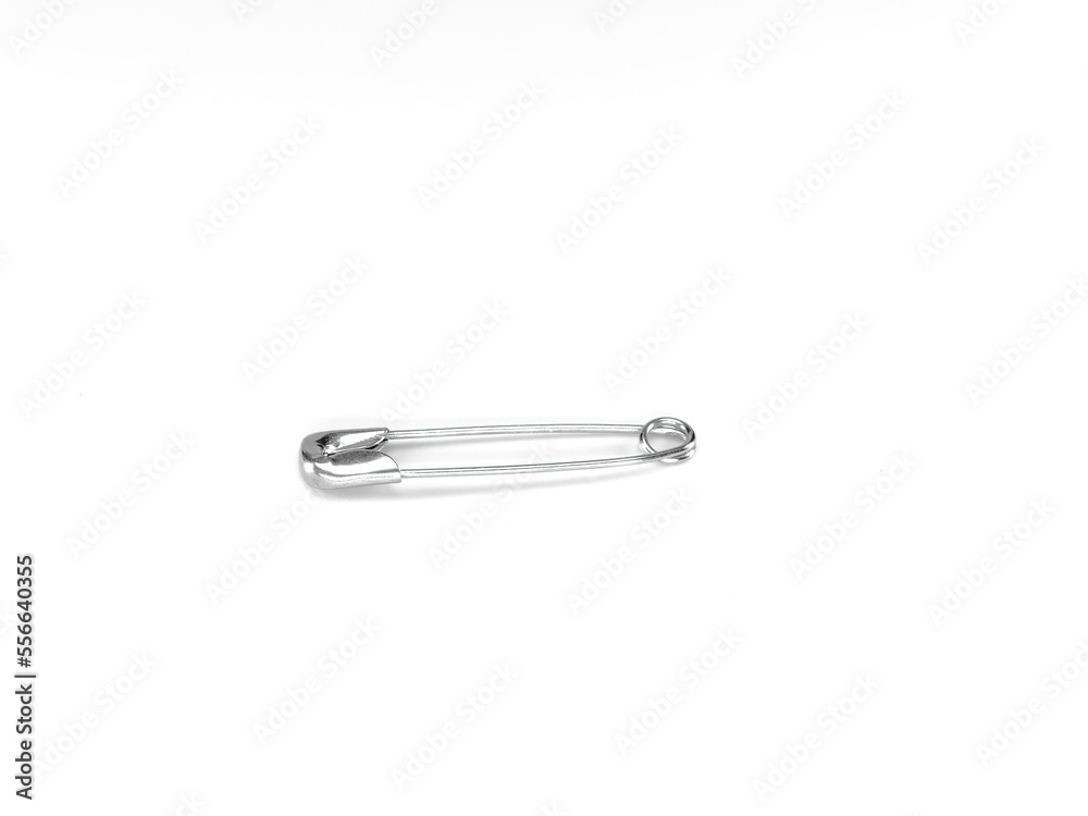 Closeup of steel safety pin isolated on white background Closeup of steel safety pin isolated on white background