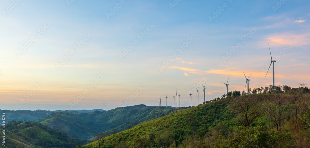 Fototapeta premium Wind turbines generate electricity on mountains in morning time, renewable energy, global warming and carbon emissions reduction concept.