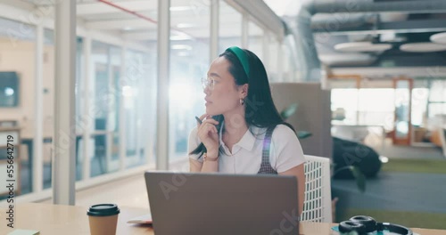Laptop, writing and notebook with a business asian woman working at her desk with a panning camera angle.