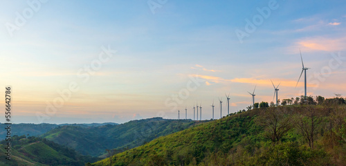 Wind turbines generate electricity on mountains in morning time  renewable energy  global warming and carbon emissions reduction concept.