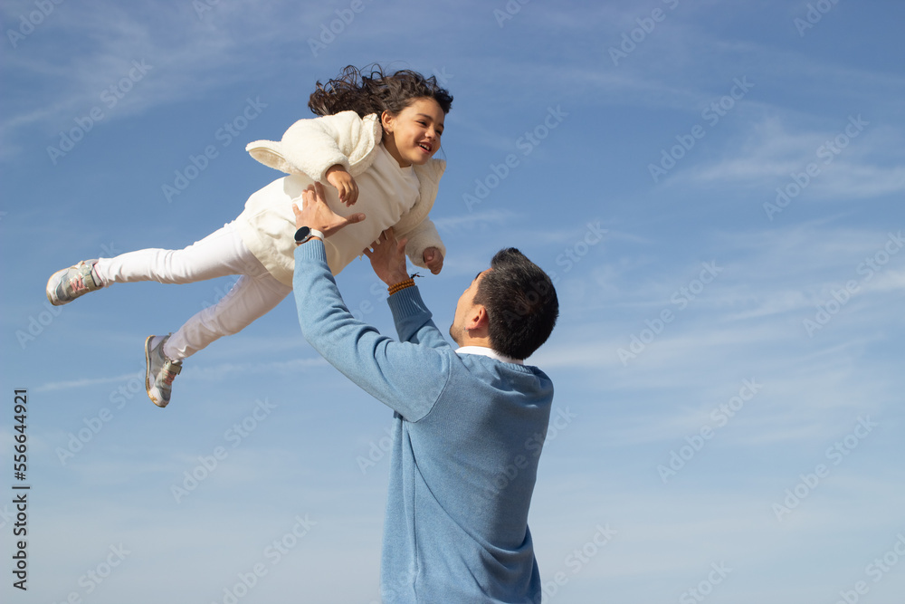 Happy father and daughter travelling together. Japanese family walking, laughing, fooling around, lifting child up. Dad leisure, family time, parenting bright Happy father and daughter travelling together. Japanese family walking, laughing, fooling around, lifting child up. Dad leisure, family time, parenting bright
