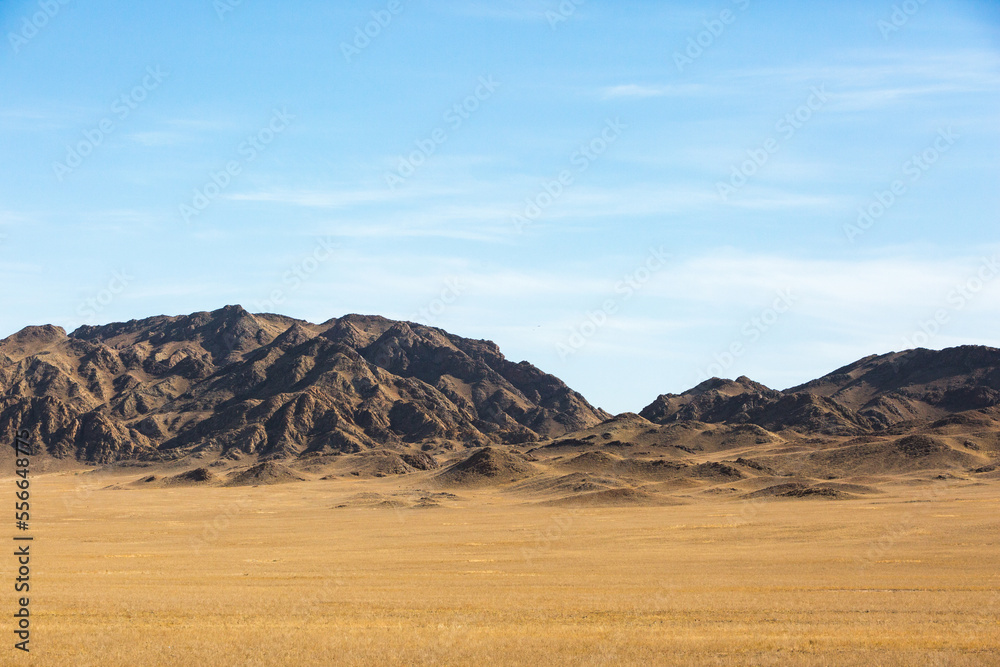 Kazakhstan landscape. Dry grass and mountains