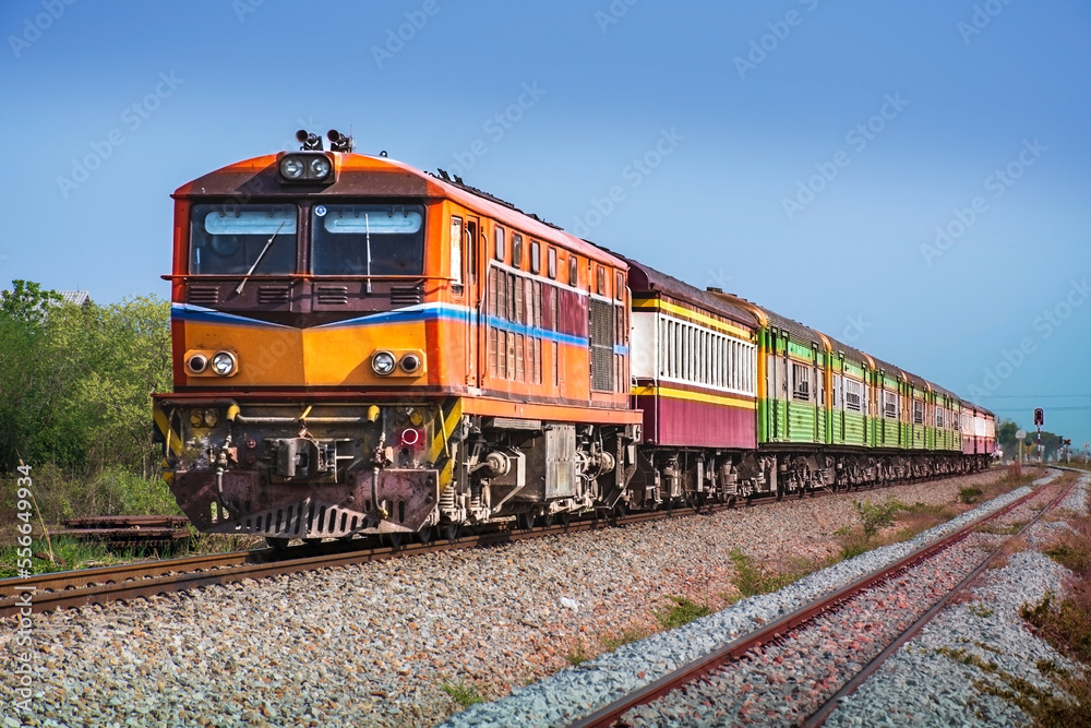 Passenger train by diesel locomotive on the railway. Passenger train by diesel locomotive on the railway.