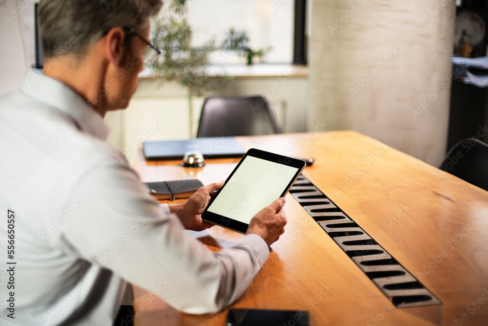 Close up of man using digital tablet..