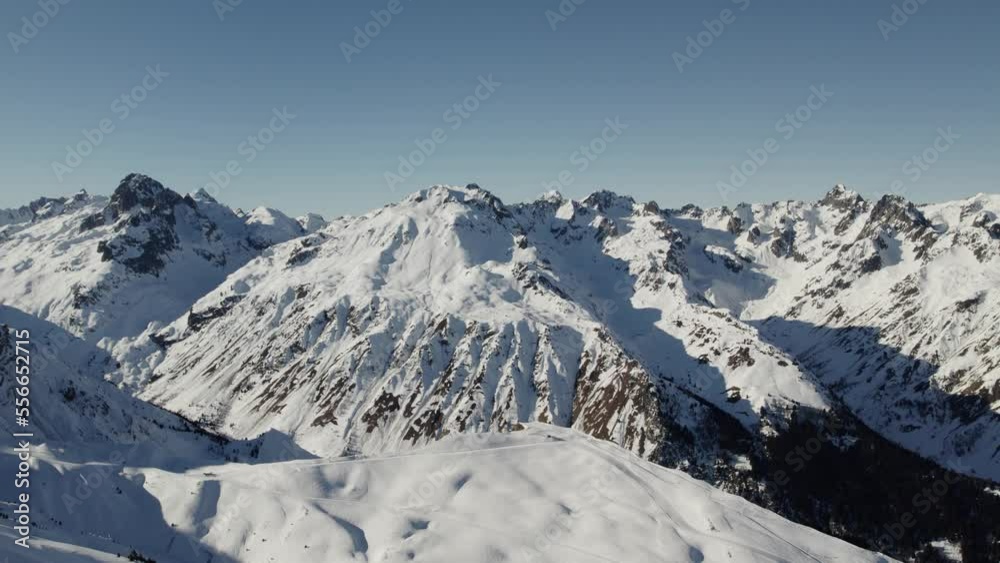 Alpine mountain peaks in La Toussuire France, Aerial flyover shot Alpine mountain peaks in La Toussuire France, Aerial flyover shot