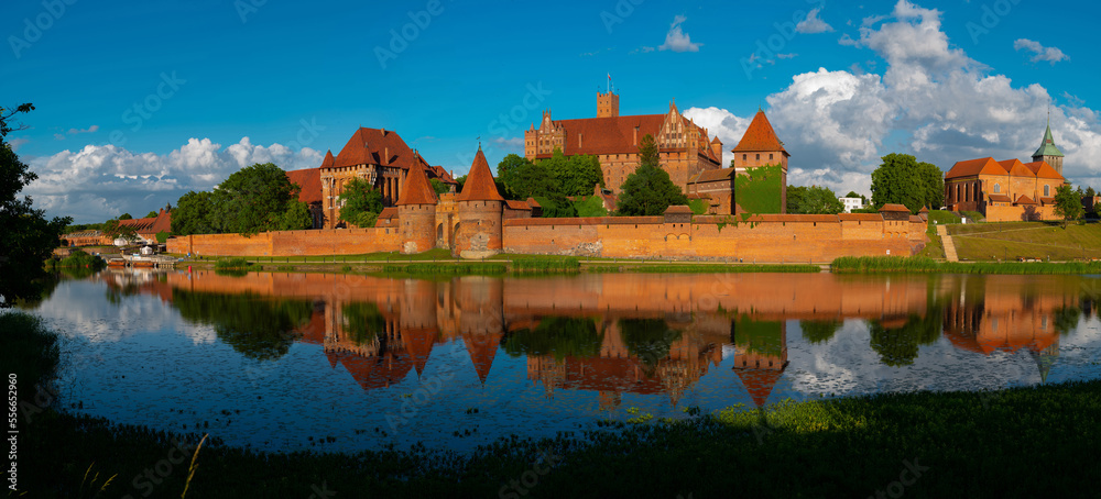Obraz premium 2022-06-13. panoramic view of castle of the Teutonic Knights Order in Malbork, Poland, is the largest castle in the world. Malbork Poland