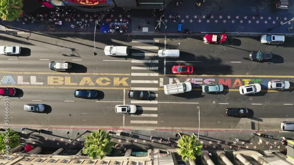 Top down aerial of cars drive at cross road in Venice, Los Angeles, United State Of America.