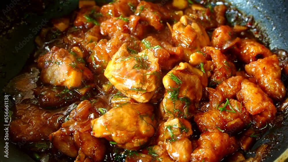 Cooking chopped chicken stew in pan, in door Chiangmai Thailand Cooking chopped chicken stew in pan, in door Chiangmai Thailand