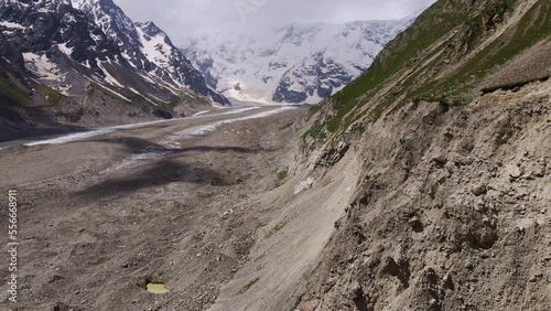 Aerial view of the Bezengi glacier and the Bezengi wall in the clouds photo