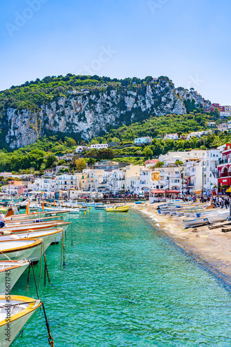 Fototapeta Naklejka Na Ścianę i Meble -  Capri, Amalfi coast, Italy - May 2019: Colorful houses on the beach of Capri island on the Mediteranean riviera