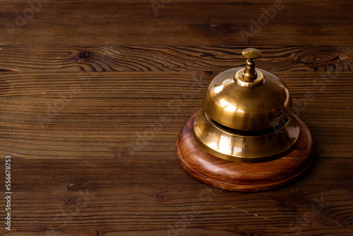 Close up of hotel golden service bell. Attention concept