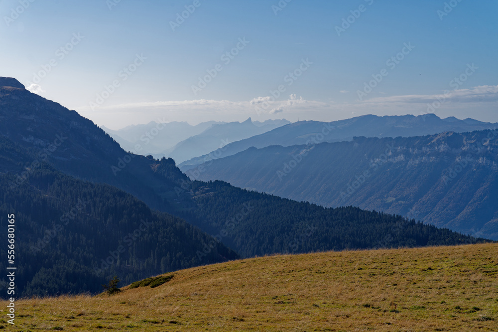 Scenic view from top of Axalp over Bernese Oberland with beautiful mountain panorama of the Swiss Alps on a sunny autumn day. Photo taken October 18th, 2022, Axalp, Switzerland. Scenic view from top of Axalp over Bernese Oberland with beautiful mountain panorama of the Swiss Alps on a sunny autumn day. Photo taken October 18th, 2022, Axalp, Switzerland.