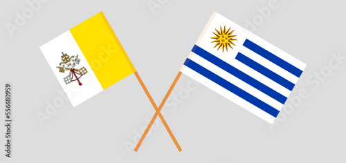 Crossed flags of Vatican and Uruguay. Official colors. Correct proportion