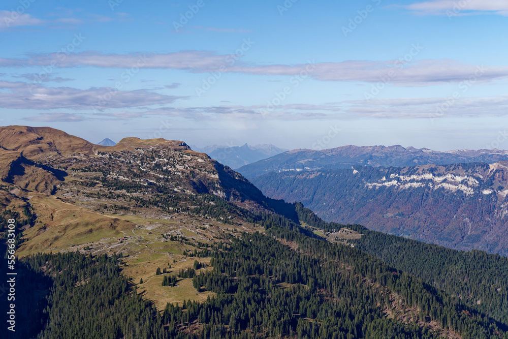 Scenic view from top of Axalp over Bernese Oberland with beautiful mountain panorama of the Swiss Alps on a sunny autumn day. Photo taken October 18th, 2022, Axalp, Switzerland.