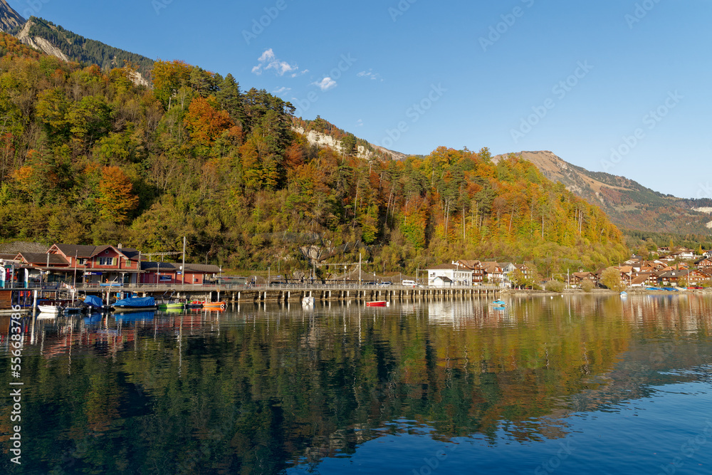 Beautiful scenic autumn landscape with Lake Brienz in the foreground at Bernese Oberland, Canton Bern, on a sunny autumn afternoon. Photo taken October 18th, 2022, Brienz, Switzerland.