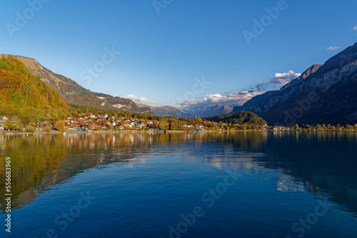 Beautiful scenic autumn landscape with Lake Brienz in the foreground at Bernese Oberland, Canton Bern, on a sunny autumn afternoon. Photo taken October 18th, 2022, Brienz, Switzerland.